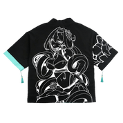 Black and turquoise kimono with white interior and exterior designs and a snake scale finish