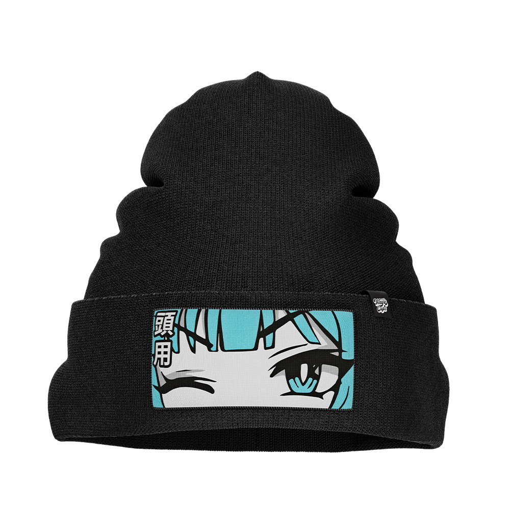Black knit beanie with a folded cuff featuring a patch of a winking anime face with blue hair and Japanese characters.